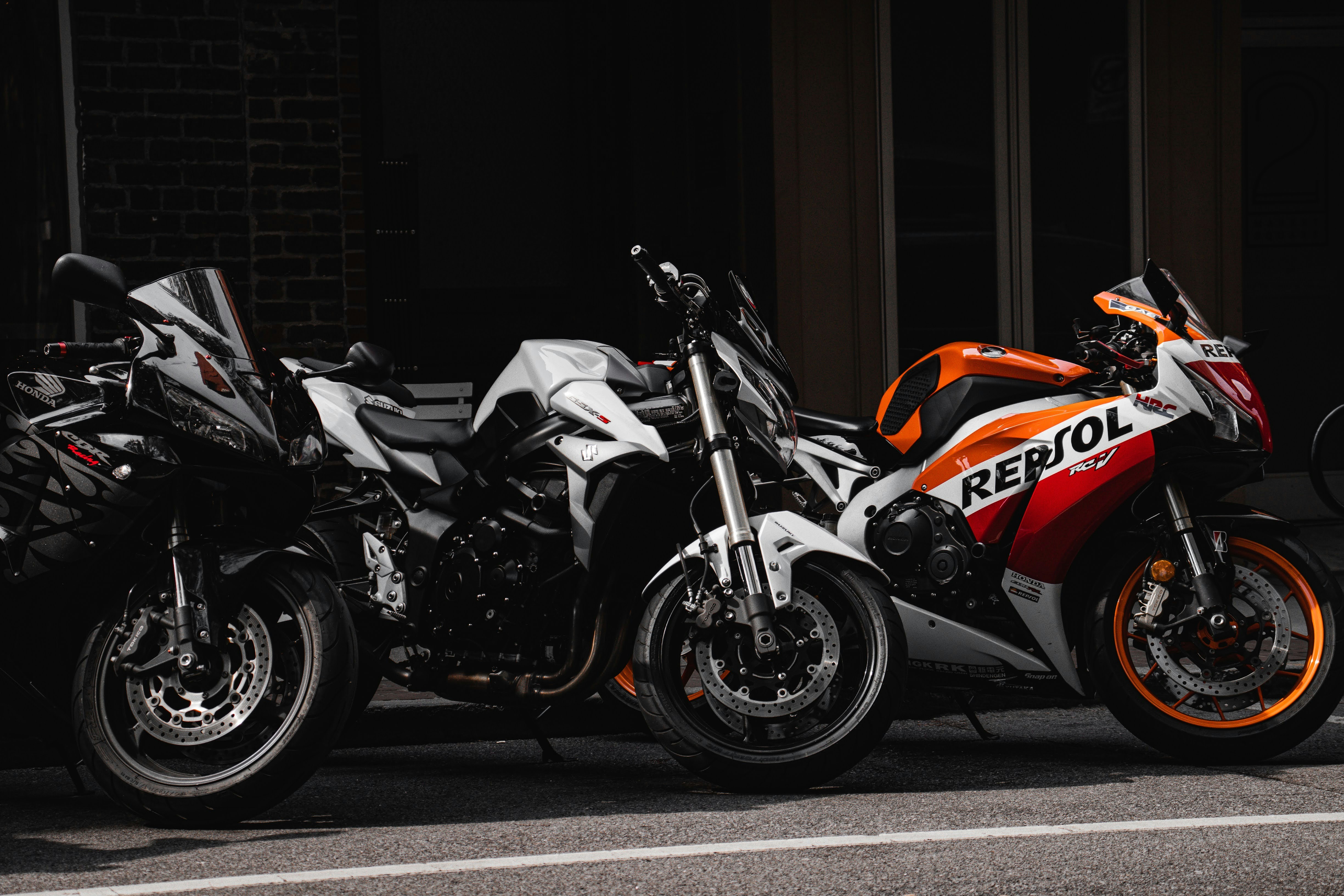 AI-Generated Image: Hyper-realistic, futuristic, sleek racing car, caught in dynamic motion blur on a rain-slicked nighttime track. The car's headlights illuminate neon vapor trails. Dramatic low-angle perspective, focusing on speed and advanced engineering. Ambient glow from digital billboards in the background. Cinematic, high-contrast, deep blacks with vibrant accents of #FF2A00 and #00A6FB.